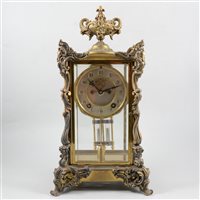 Lot 82 - French style American four glass mantel clock, cast urn finial, silvered dial with visible escapement, movement striking on a gong signed Ansonia, New York, 40cm.