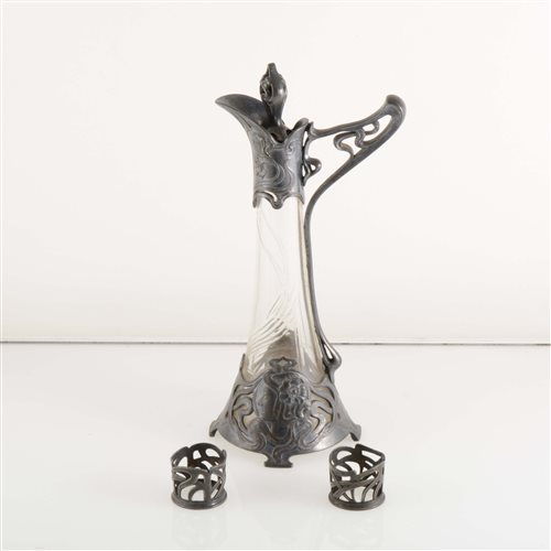 Lot 240 - An Art Nouveau/ Secessionist pewter and glass liqueur decanter and two liqueur glass holders, by WMF
