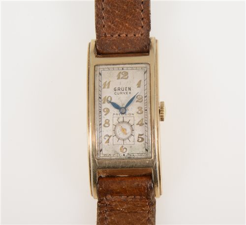 Lot 317 - Gruen - a gentleman's Curvex wrist watch, rectangular arabic dial with subsidiary seconds dial in a 10k gold filled case, strap model