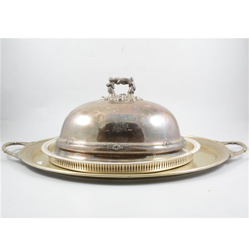 Lot 116 - Victorian electroplated oval meat dish cover, cast handle, 36cm, an oval plated tea tray, a modern plated gallery tray, a salver and a stand, (5).
