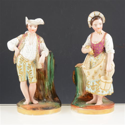 Lot 2 - Pair of French porcelain figural spill vases, the standing figures designed as flasks, 24cm.