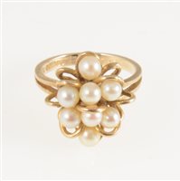 Lot 270 - A cultured pearl dress ring, eight 4mm cultured pearls peg set on a 9 carat yellow gold mount with gold loops between, ring size M, gross weight approximately 4.9gms.