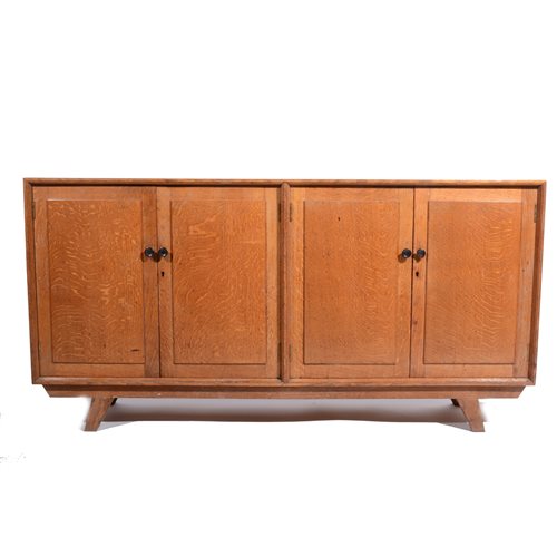 Lot 506 - An Arts and Crafts style oak sideboard, circa 1950