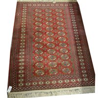 Lot 492 - Bokhara rug, three rows of guls on a red field, muti-bordered, 176cm x 127cm.