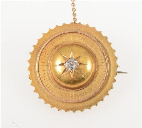 Lot 264 - A Victorian yellow metal circular target brooch 30mm diameter, star gypsy set with an old brilliant cut diamond to centre, hair compartment to back with woven hair.
