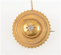 Lot 264 - A Victorian yellow metal circular target brooch 30mm diameter, star gypsy set with an old brilliant cut diamond to centre, hair compartment to back with woven hair.