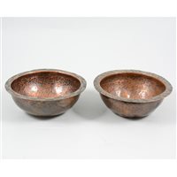 Lot 80 - Hugh Wallis, Arts and Crafts, two copper bowls with copper and white metal chevron edging, hand beaten and unpolished finish, stamped HW. (2)