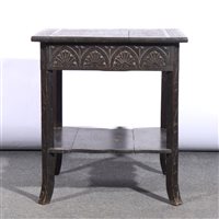 Lot 370 - Carved oak centre table.