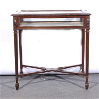 Lot 397 - French red walnut display table, serpentine outlines.