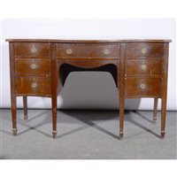 Lot 412 - Edwardian mahogany serpentine sideboard.