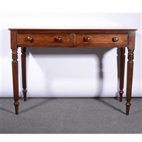 Lot 474 - A Victorian mahogany writing table, adapted, fitted with two frieze drawers, ringed and fluted legs, width 107cm.