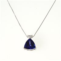 Lot 290 - A tanzanite and diamond pendant, the trillion cut tanzanite graded AAAA approximate weight 3.75 carats three claw set in a platinum mount with a triangular shaped diamond to top
