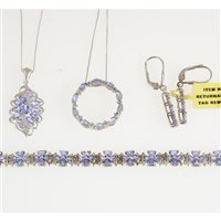Lot 283 - A tanzanite bracelet, two pendants and a pair of earrings, the bracelet set with nineteen floral links each comprising four triangular stones, set in silver with platinum overlay