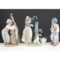 Lot 42 - Lladro group, A Big Sister, No. 5735, width 22cm, a Lladro group Girl at a pump, three Lladro band figures, a Nao figure, (6).