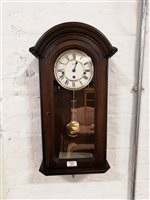 Lot 367 - Modern stained wood wall clock, signed Hermle.