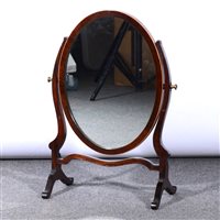 Lot 463 - Edwardian mahogany toilet mirror, oval plate with boxwood outlines, frame with standard ends, height 58cm.