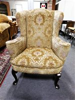 Lot 463 - George III style wing back armchair, shaped arms, bowfront seat, cabriole legs, pad feet, 81cm.