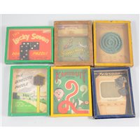 Lot 190 - Small collection of vintage ball bearing games, printing sets, and other card games.