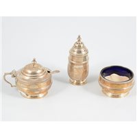 Lot 375 - A silver three piece condiment set by Zachariah Barraclough & Sons, blue glass inserts, Chester 1923-1925
