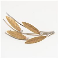 Lot 289 - A 1960s 14 carat yellow and white gold leaf design brooch, the yellow gold leaves bark textured and set with four brilliant cut diamonds