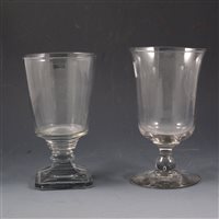 Lot 16 - George III glass goblet, bell-shape bowl; and a Regency goblet, bucket bowl (2).