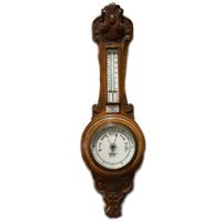 Lot 449 - Carved oak aneroid barometer, the dial signed Benetfink & Co. Ltd, Cheapside, thermometer over, 70cm.