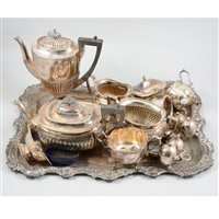 Lot 161 - A four piece silver plated teaset on a silver plate tray and seven small silver plated cruet and jugs