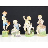 Lot 23 - A collection of Royal Worcester Months of the Year figurines, comprising January, February, March, April, May, June, July, October and December, 20cm and smaller, (9)