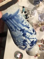 Lot 30 - A Japanese crackle glazed blue and white vase, baluster shape, painted with bird and flowers, 30cm.