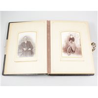 Lot 136 - Victorian black leather bound family photo album including one with a vintage bicycle.