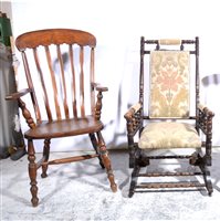 Lot 387 - American stained wood rocking chair, patterned upholstery