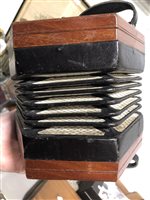 Lot 174 - An Anglo concertina squeezbox by Lachenal & Co of London, twenty-nine buttons, pierced mahogany case