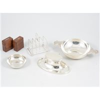 Lot 380 - A quantity of silver items, including a quaich by Wakely & Wheeler, London 1946; an inkwell with clear glass insert by A & J Zimmerman Ltd, weighted, Birmingham 1913; a toast rack by William Hutton...