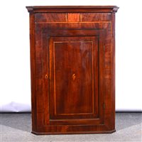 Lot 423 - George IV mahogany and banded hanging corner cupboard.