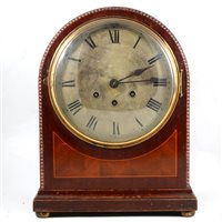 Lot 85 - A mahogany mantel clock, domed top, strike and Westminster chime on a gong.