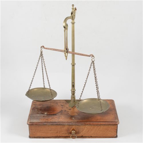 Lot 154 - Set of brass and steel beam balance scales, W & T Avery, mahogany platform with a drawer, 26cm and a collection of small weights.