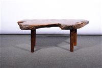 Lot 611 - A British post-war yew wood free-form slab coffee table, 1941-1951