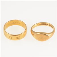 Lot 272 - A 22 carat yellow gold wedding band, 5.8mm wide flat section with engraved pattern, hallmarked London 1971, approximate weight 5.3gms