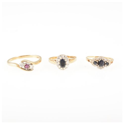 Lot 210 - Three 9 carat gold gem set rings, all 9 carat gold yellow and white mounts, a ruby and diamond three stone crossover