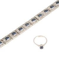 Lot 217 - A sapphire solitaire ring, the 4.5mm cushion shaped stone claw set in an all white metal mount, shank marked 18ct, ring size M,a paste set deco style bracelet