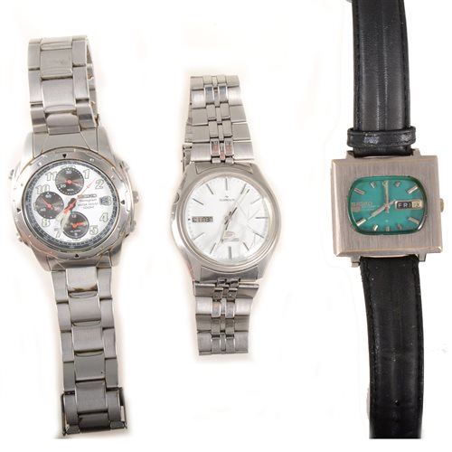 Lot 267 - Seiko - three gentleman's wrist watches, a gentleman's Seiko 5 automatic with curved rectangular dark green baton dial having a centre seconds hand and a day and date aperture (3)