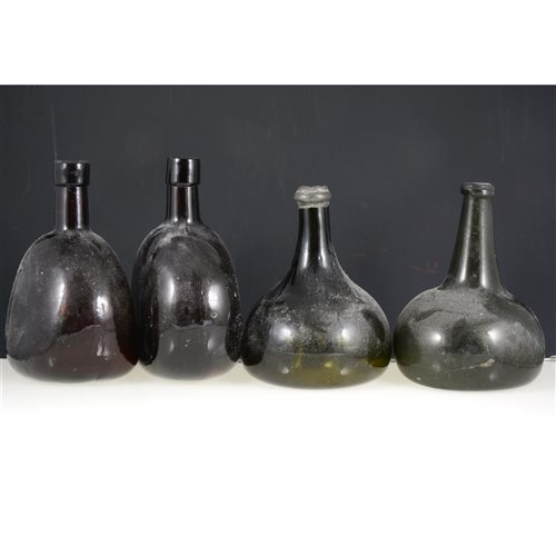 Lot 1 - Two olive green onion shaped glass bottles, and two brown glass bottles (4).