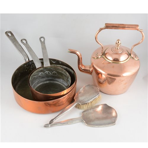 Lot 125 - Two copper kettles, oval 23cm, round 32cm, horse brasses, a set of three copper saucepans diameter 15cm, 18cm and 25cm, 8cm deep, two Sam Brown leather belts, three piece silver brush/mirror set