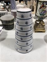 Lot 15 - A quantity of Rye pottery, including a conical shaped lamp base, vertical purple stripes with black stars and orange circles, 22cm, another with blue horizontal stripes, stars and circles, 21cm. (13)