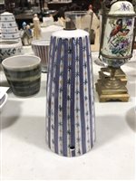 Lot 15 - A quantity of Rye pottery, including a conical shaped lamp base, vertical purple stripes with black stars and orange circles, 22cm, another with blue horizontal stripes, stars and circles, 21cm. (13)