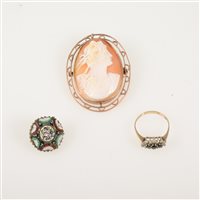 Lot 214 - An oval carved shell cameo brooch in a yellow metal frame overall 50mm x 40mm, 16mm micro mosaic brooch, 9 carat ring set with cubic zirconia (3)