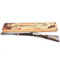 Lot 93 - Mettoy 'Winchester' saddle toy gun, with bullets and original box.