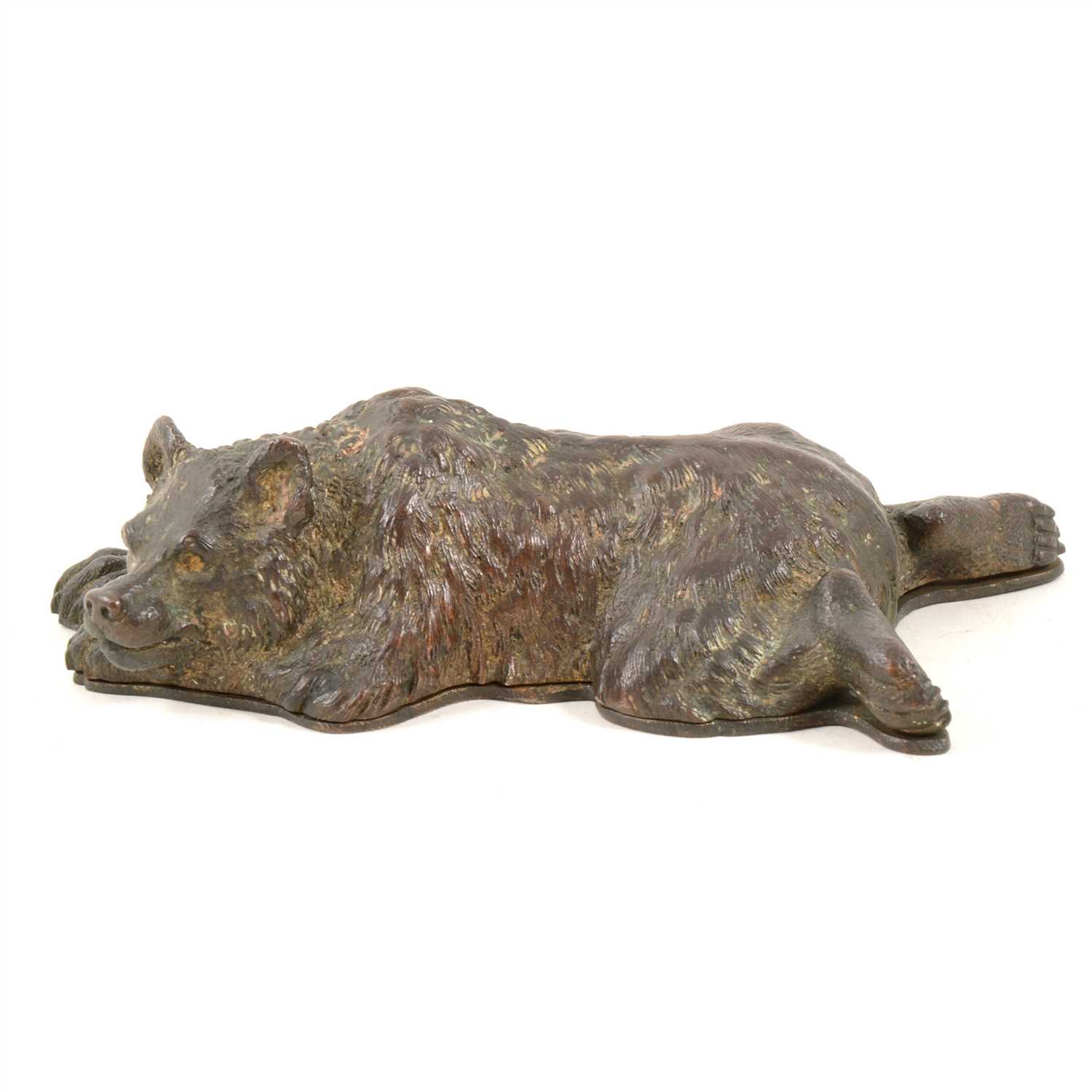 Lot 152 - Bronzed and gilt metal novelty desk-top stamp box, designed as a sleeping bear, length 15cm.