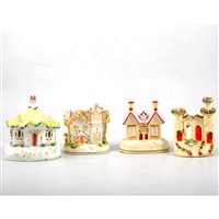 Lot 49 - A collection of twenty five Staffordshire pottery cottages and pastille burners.