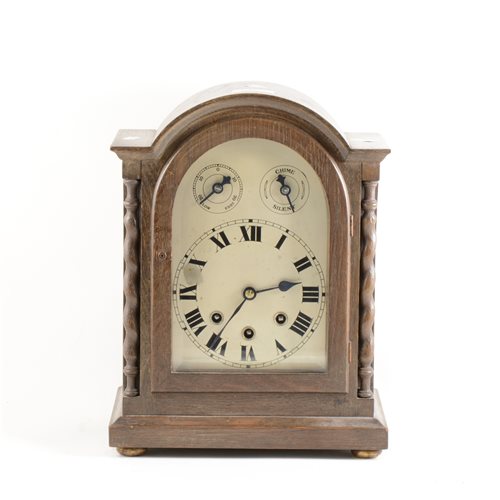 Lot 103 - German oak cased mantel clock, arched silvered dial, ...